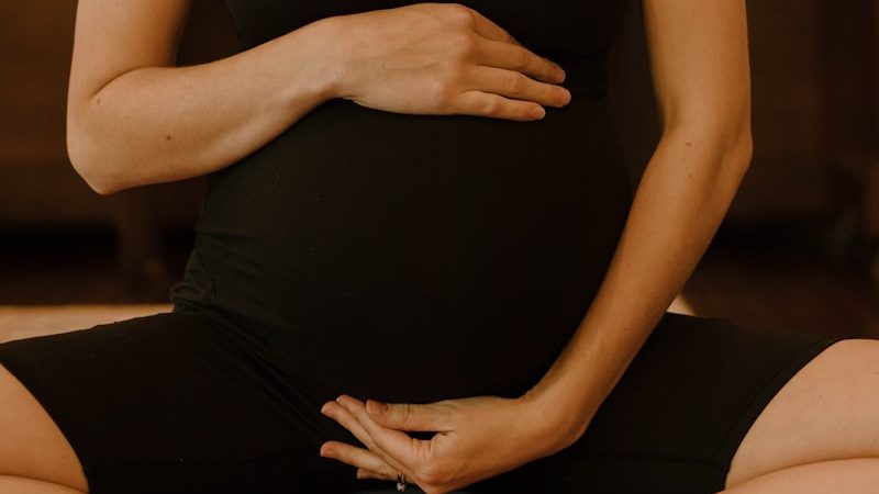 Pregnant patient receiving prenatal wellness care